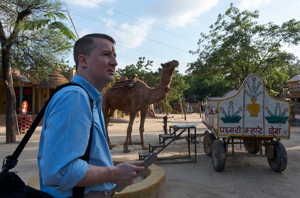 Nathan in front of a camel in Jaipur