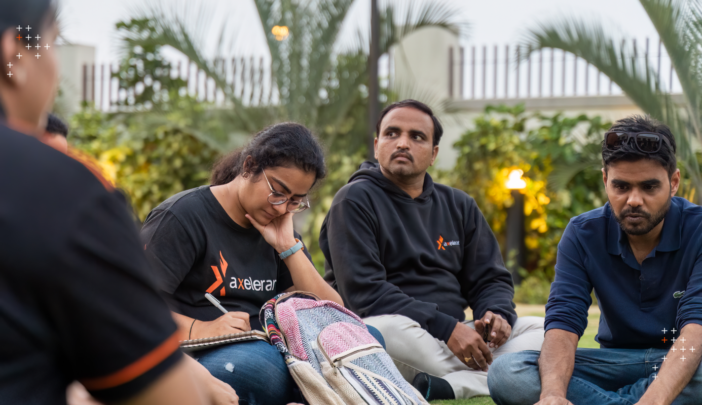 A group of employees brainstorming in the garden